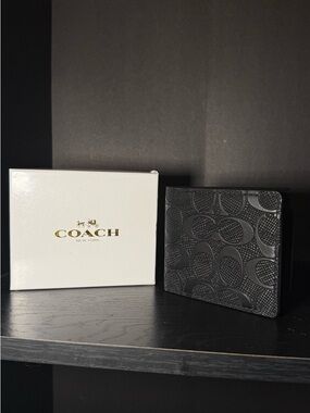 COACH Black Signature Embossed Leather Bifold Wallet